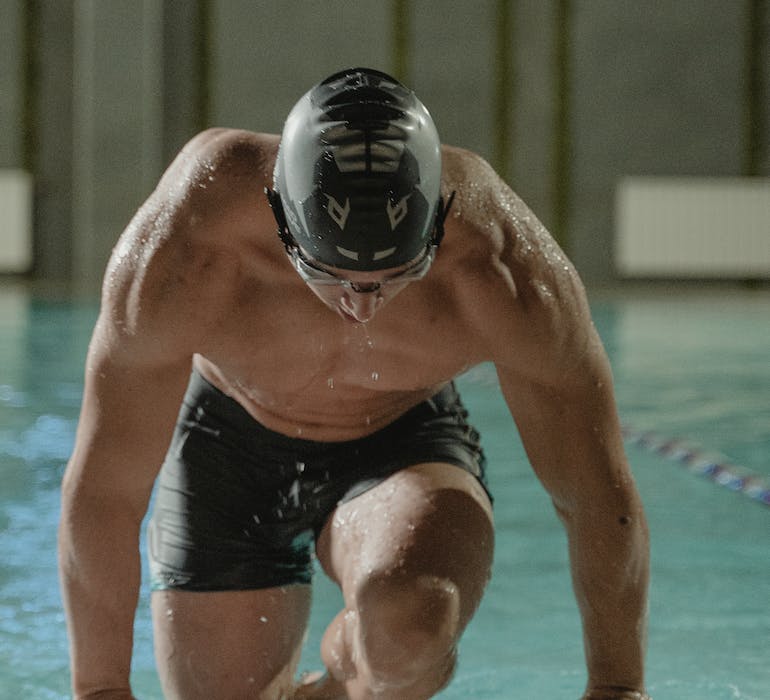 Swimmer using Rebound Recovery to reduce muscle fatigue after workout
